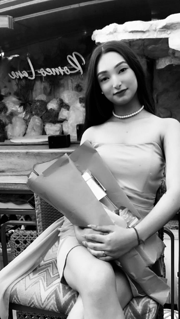 Tanya holding a bouquet of flowers
