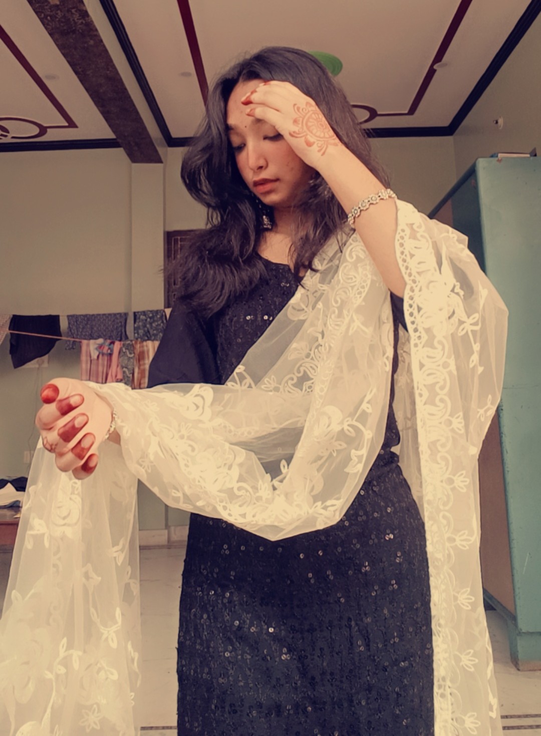 Tanya in a black embellished traditional outfit with an ivory embroidered dupatta