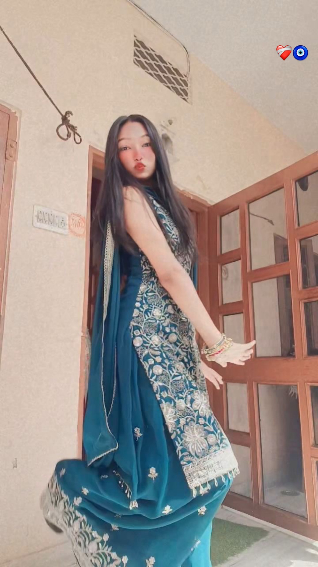 Tanya in an elegant teal traditional saree
