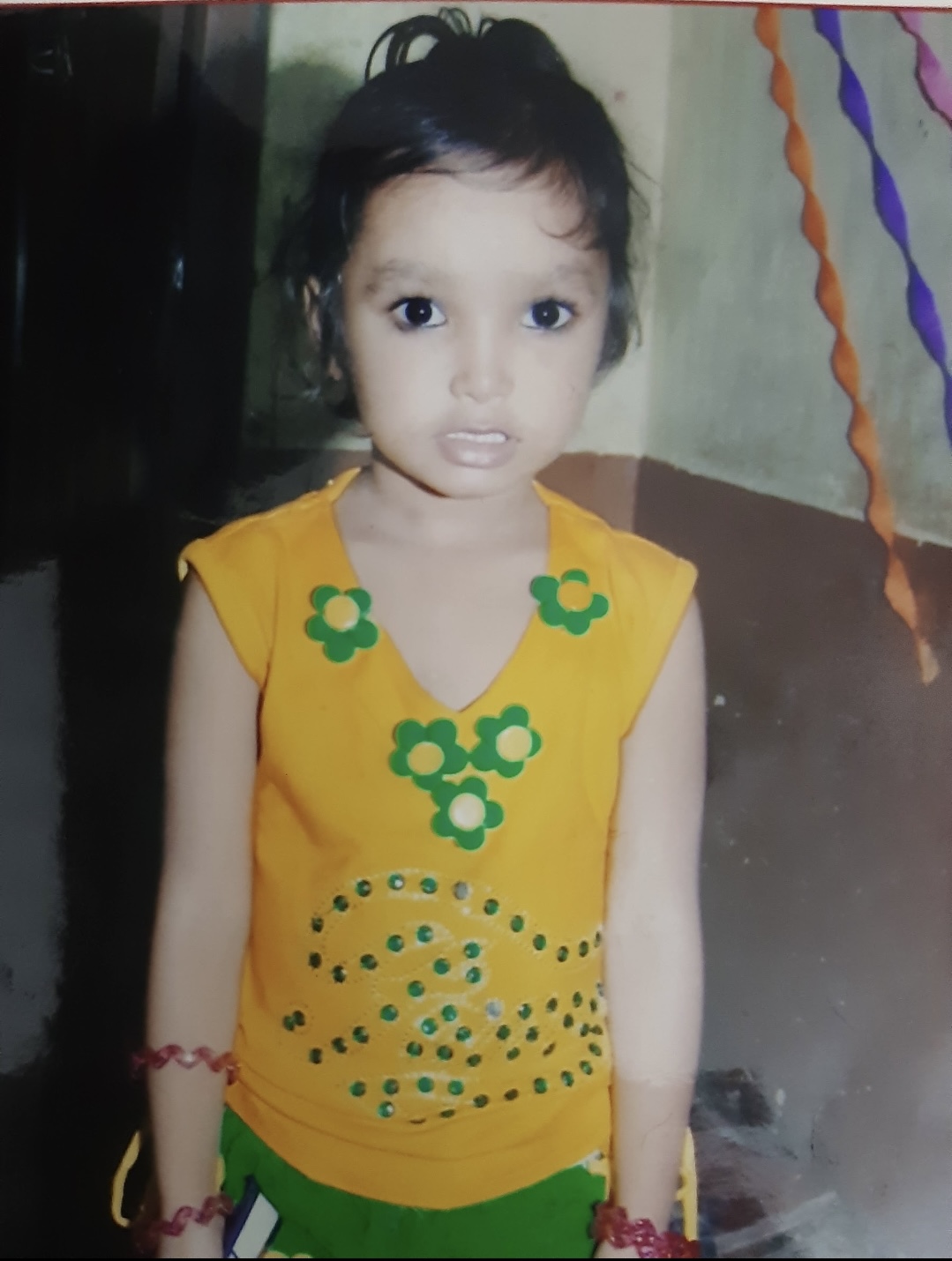 Little Tanya in a yellow floral top